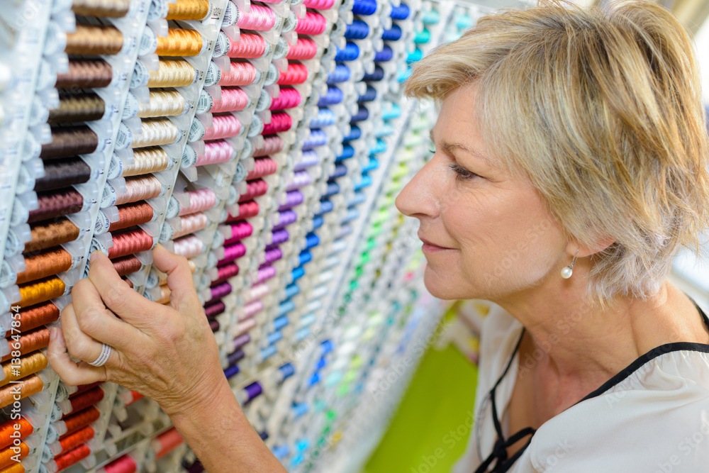 Wall mural choosing cotton at the haberdashery store