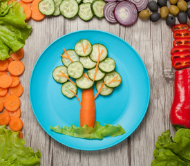 Vegetable tree on plate and table with ingredients