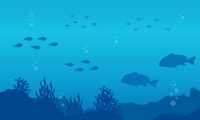 Silhouette of fish on the sea landscape