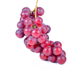 A bunch of red grapes on a white background