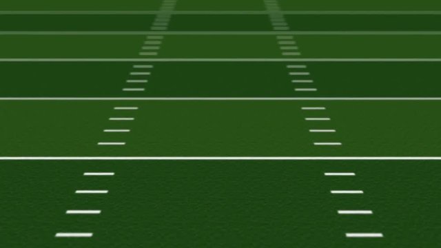 Football Field Loop - Seamless loop features yard lines scrolling toward the point of view at field center with focus depth of field.