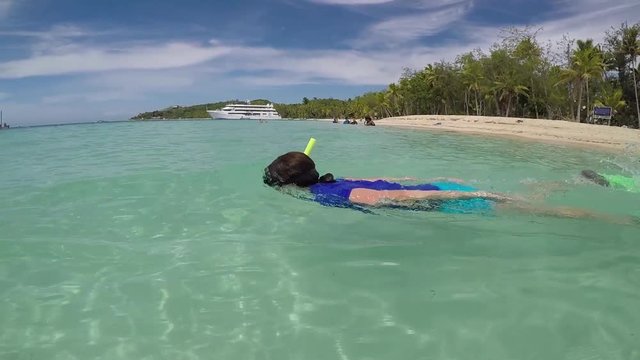 FJ 136 Young woman snorkeling in The Blue Lagoon on Nanuya Lailai Island Fiji