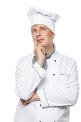 portrait of a pensive handsome chef in the working suit on a white background