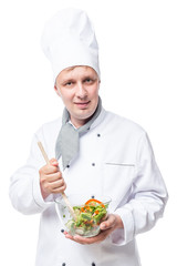 professional chef mixing vegetable salad in a bowl on a white background