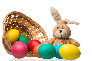 beautiful composition easter bunny and colored eggs on a white background