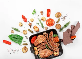Foto auf Acrylglas Grill / Barbecue Cast iron grill pan with steak, sausages, grilled vegetables