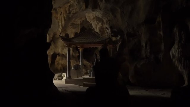 Small Buddhist temple in the cave. Bich Dong Pagoda