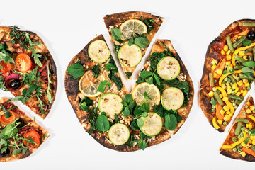 Three different vegetarian pizza on white background close up