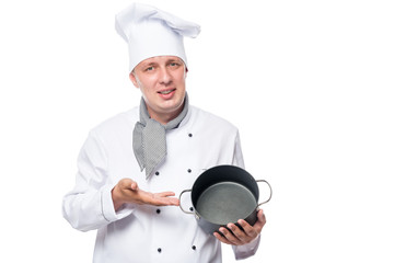Horizontal portrait of a happy cook with the empty pot in his hands on a white background