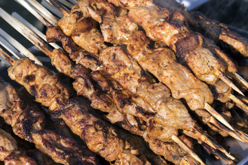 Chargrilled chicken on wooden skewers