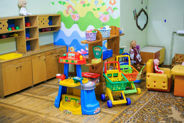 The room in kindergarten with toys, machines, dolls, books.