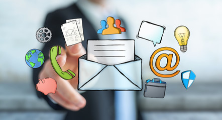 Businessman touching manuscript contact icon with his finger