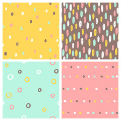 Set of 4 seamless patterns. Paint drops, dots, rounds. Vector hand drawn backgrounds