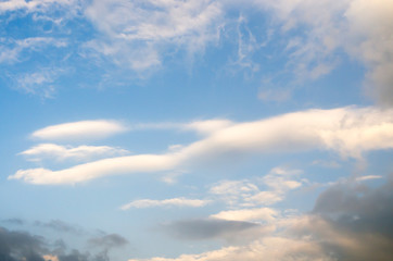 Blue sky with white cloud and partial dark clouds. Sky cloud. 