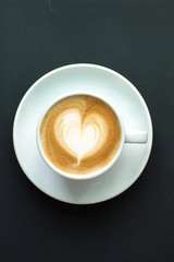 Hot coffee cafe latte on black background
