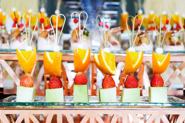Mixed Fruit and dessert on glass plate in party