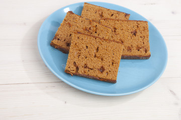 Traditional Dutch cake Ontbijtkoek on wooden background