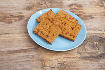 Traditional Dutch cake Ontbijtkoek on wooden background