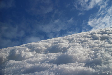 white snow on mountain slope against the blue sky low angle view