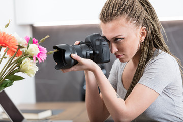 photographer in a kitchen training and checking