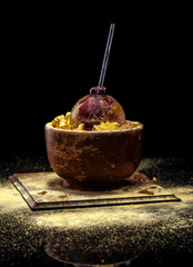 Exotic alcoholic cocktail on a dark background.