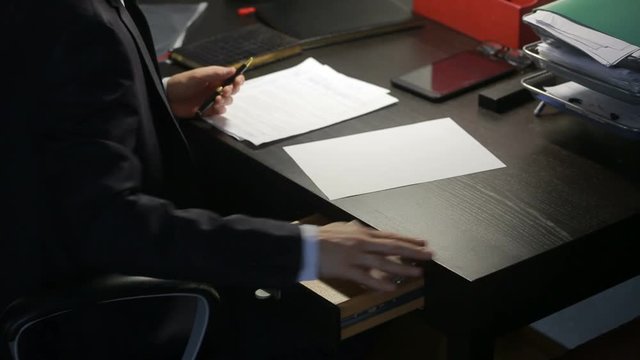 corruption, bribery and fraud concept - close up of businessman taking money
