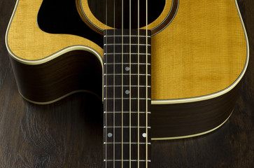 Obraz na płótnie Canvas acoustic guitar neck fingerboard frets strings music case close inlay creativity art sound vibration play music guitarist