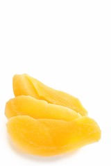 Fototapeta na wymiar Dried Mango Slices on White Background