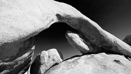 Black and white image of rock arch in Joshua Tree National Park