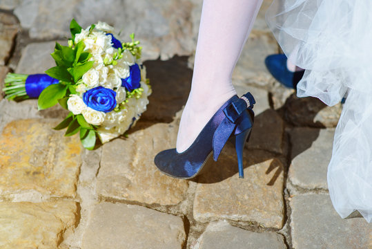 blue wedding shoe near flowers