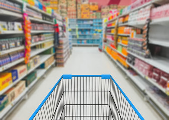 Abstract blurred photo of store with trolley in department store background