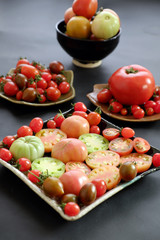 Fototapeta na wymiar Collect of tomatoes, cheap food anticancer