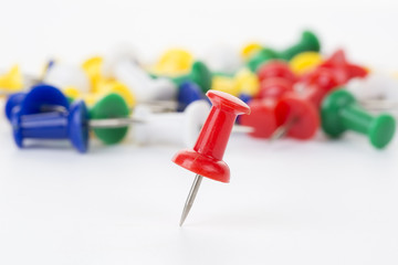 Push pin on white background.