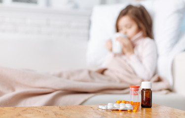Medicines lying on the surface of table