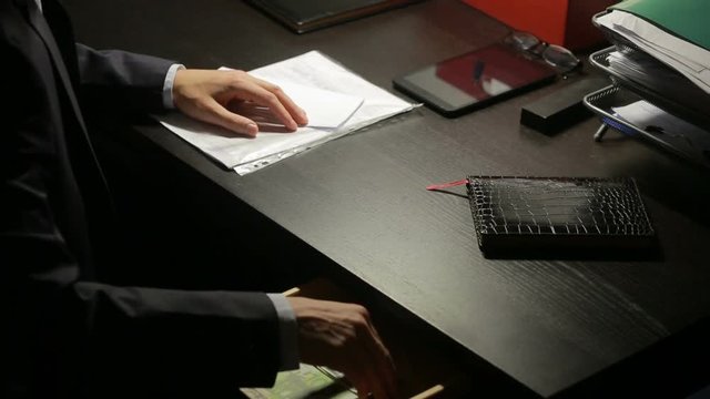 corruption, bribery and fraud concept - close up of businessman taking money