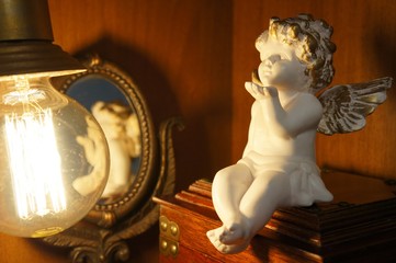 angel, mirror and lamp