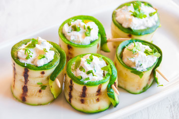 Grilled zucchini rolls stuffed with cheese