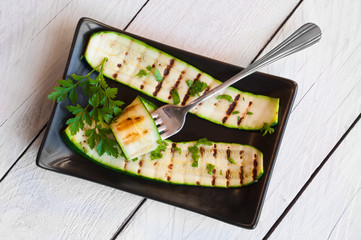 Grilled zucchini on plate