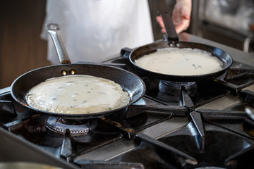 Pancakes cooking in a griddle