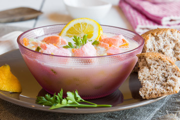 Salmon fish soup with cream and lemon