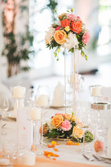 The elegant dinner table with flowers and cards