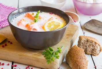 Salmon fish soup with cream and lemon
