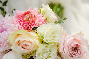 Beautiful bridal bouquet with wedding rings