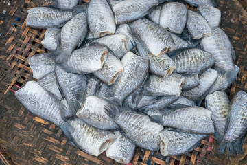Thai traditional preserved fishes : Top view of dried salted damsel fish in the market.