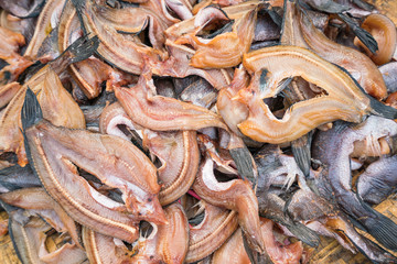 Thai traditional preserved fishes : Top view of Dried snake head fish - Deep fried marinated fish in the market.