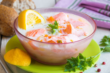 Salmon fish soup with cream and lemon