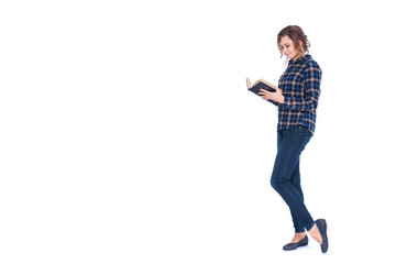 Full length portrait of a smiling beautiful woman student holding book isolated on a white background
