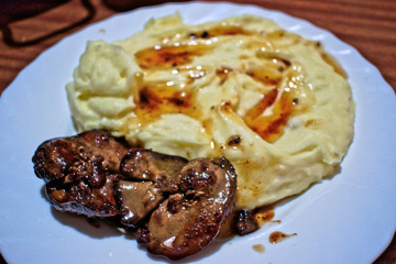 Liver and mashed potatoes on a plate