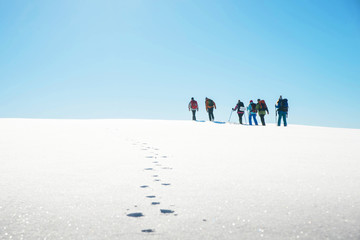 travelers  with backpacks in the mountains, teamwork, sports, lifestyle concept