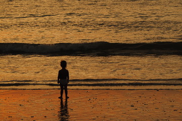 Fototapeta na wymiar Baby alone on the beach